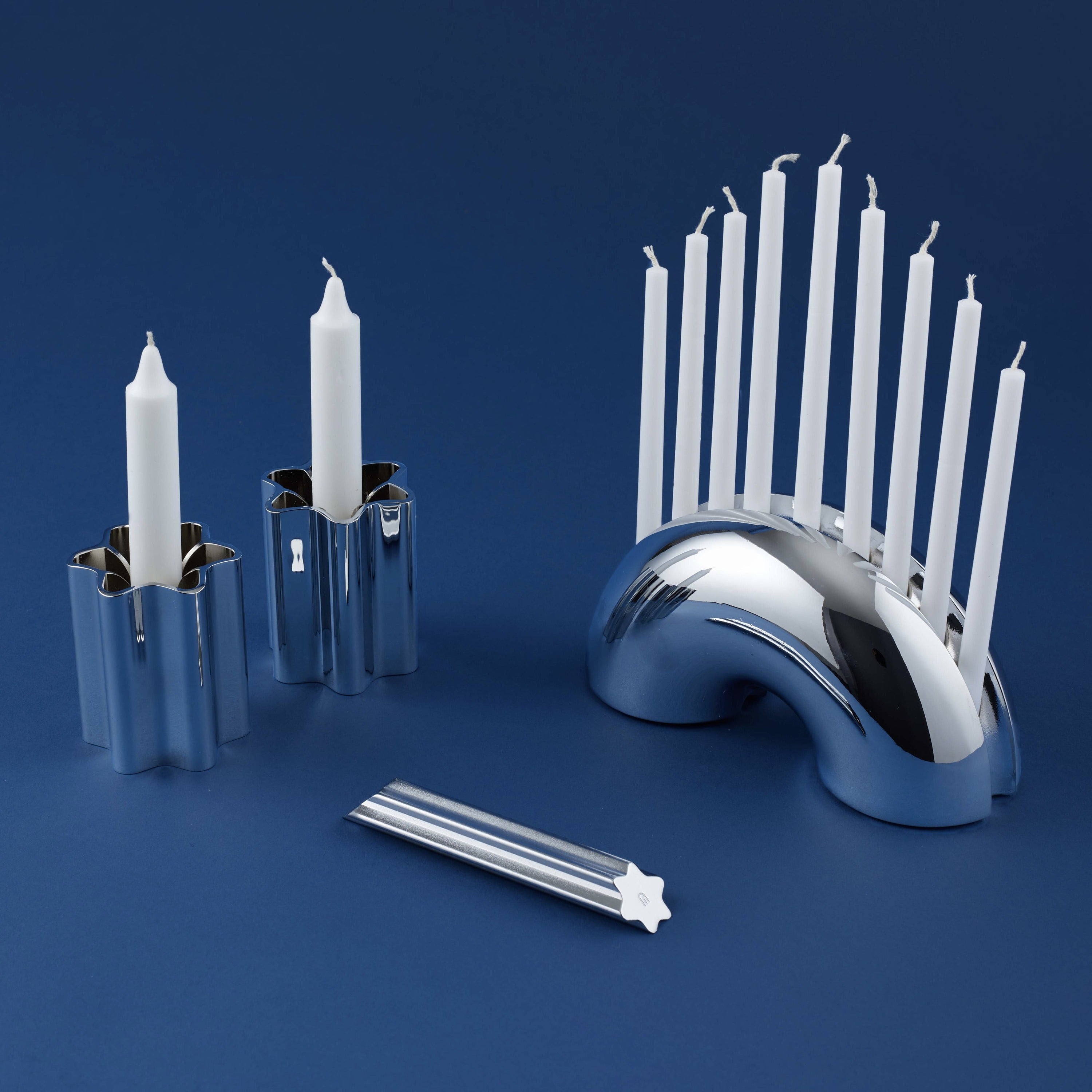 1 Chrome Menorah, 1 Chrome Mezuzah and 2 Chrome Candle Holders.